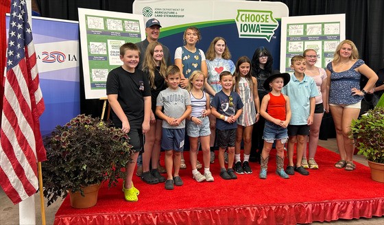 Secretary Naig and student artists featured in 2027-2027 Choose Iowa Coloring Calendar